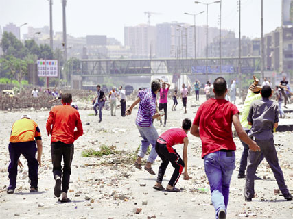 Dérapages au Caire et à Alexandrie,Des dizaines de partisans de Morsi tués