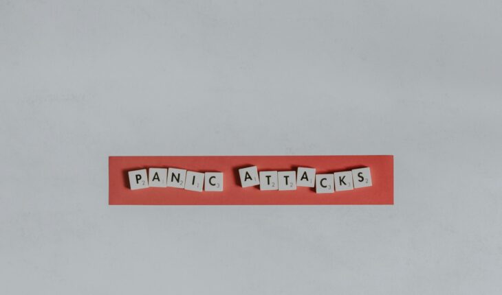 a red piece of paper with the words panic attacks spelled on it