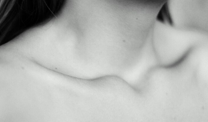 topless woman in grayscale photography